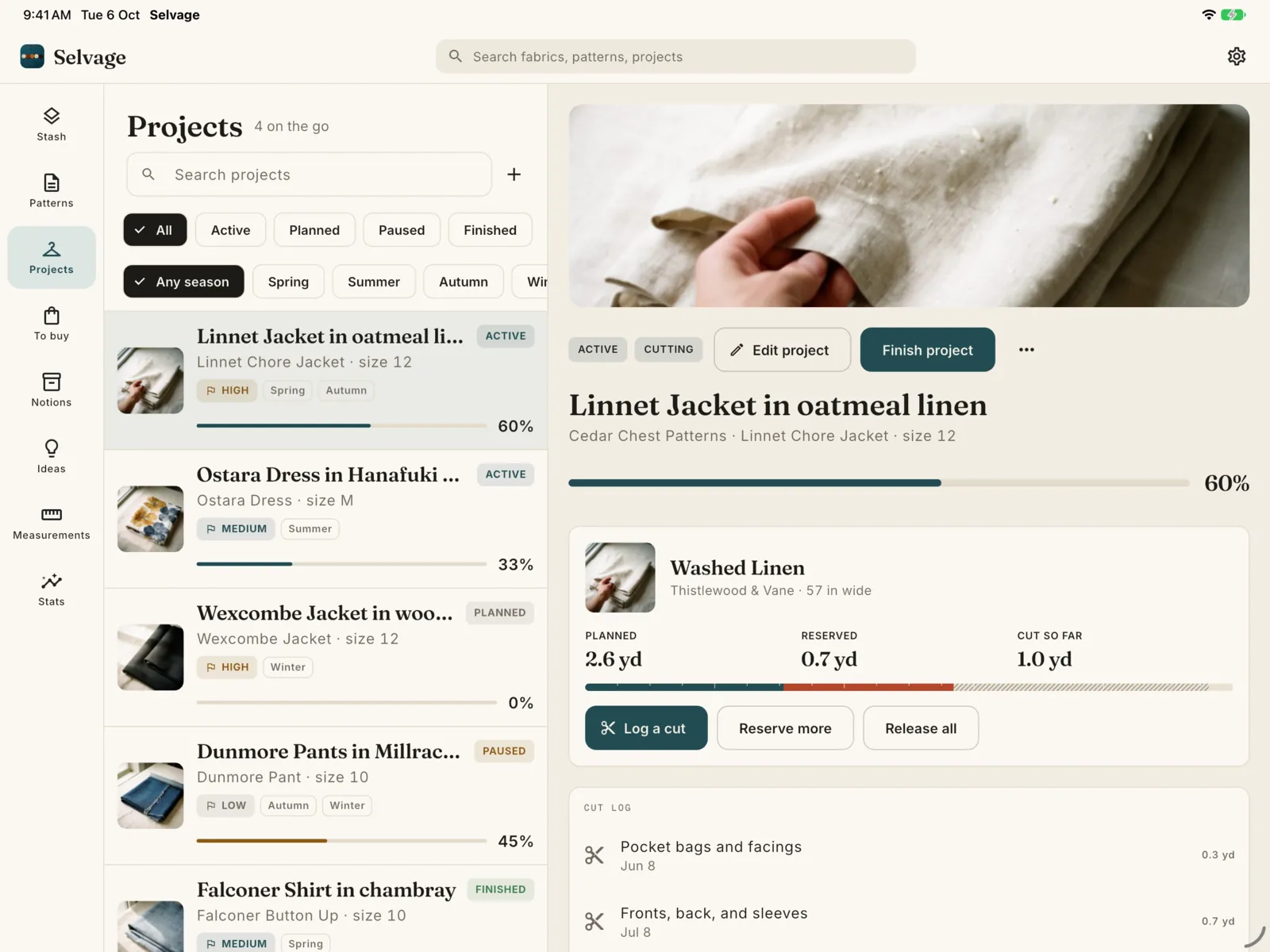 Projects on iPad, beside a linen jacket that is 60 percent done with its planned, reserved and cut fabric